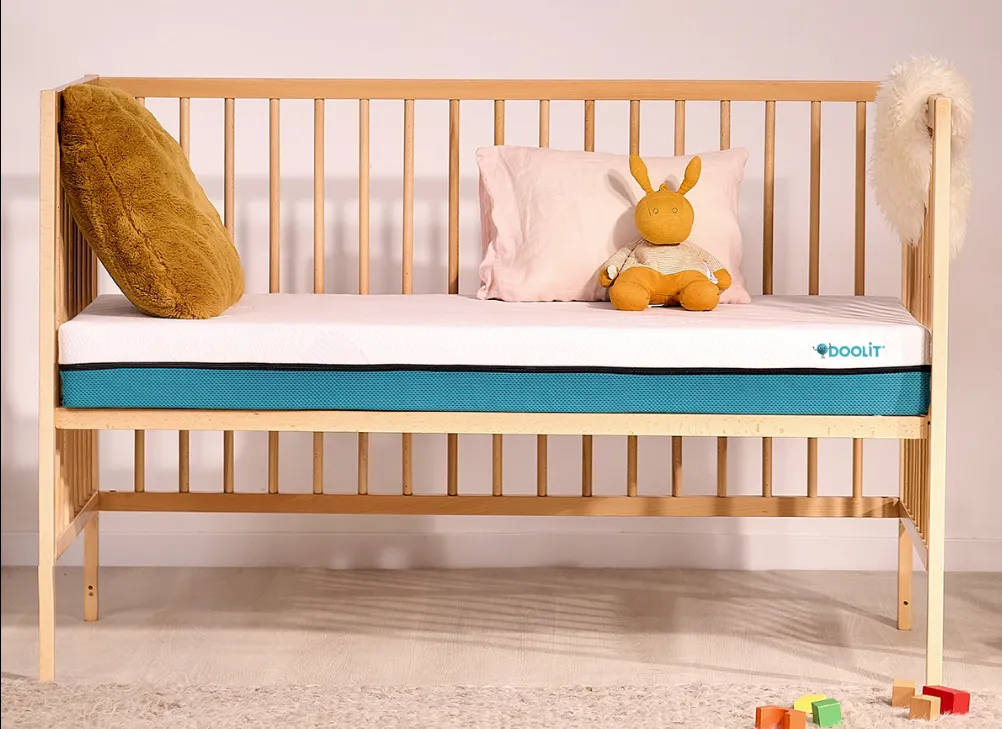 Doolit Matelas Tiny, matelas bébé bi-densité dans un lit à barreaux